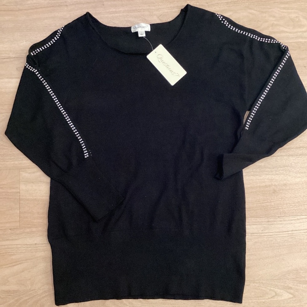 Questions Women’s Black Cold Shoulder Sweater with Silver Metal Embellishment